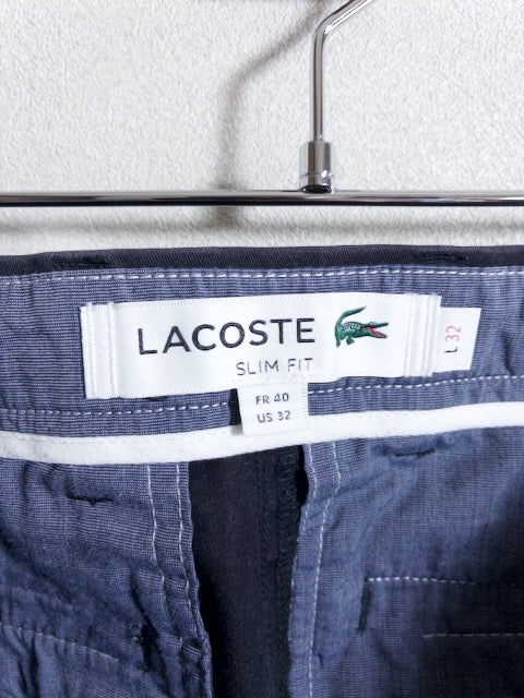 Lacoste - ローライズテーパードシルエットの黒スリムフィットパンツ
