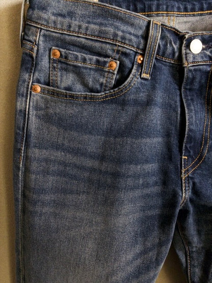 Levi’s - 502 色落ちとアタリが映えるローライズスリムテーパード