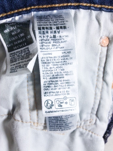 Levi’s - 502 色落ちとアタリが映えるローライズスリムテーパード